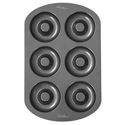 Picture of Wilton 6-Cavity Doughnut Baking Pan, Makes Individual Full-Sized 3 3/4" Donuts or Baked Treats, Non-Stick and Dishwasher Safe, Enjoy or Give as Gift, Metal (1 Pan)
