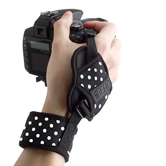 Picture of USA GEAR Professional Camera Grip Hand Strap with Polka Dot Neoprene Design and Metal Plate - Compatible with Canon , Fujifilm , Nikon , Sony and more DSLR , Mirrorless , Point & Shoot Cameras