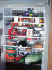 Picture of Camco 28" RV Refrigerator Bars - Holds Food and Drinks in Place During Travel, Prevents Messy Spills, Spring Loaded and Extends Between 16" and 28" - Oak Finish (3 Pack) (43823)
