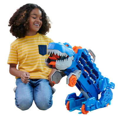Picture of Hot Wheels City Toy Car Track Set, Ultimate T-Rex Transporter, Dinosaur Hauler for 20+ Vehicles, Semi Transforms into Dino with Lights & Sounds