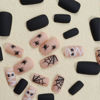 Picture of Halloween Press on Nails Medium Square Fake Nails Matte Glue on nails Nude False Nails with Cute Mummy Spiders Webs Design Halloween Nails Black Full Cover Stick on Nails for Women Girls 24 Pcs