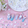 Picture of Sinyanail 300pcs Nail Art Charms Kit,Over 100pcs Mixshape Resin Nail Gems and 100 pcs Mixed Flatback Nail Rhinestones Pearls with Over 100pcs Nail Sequins for Nail Art Accessories(White)