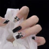 Picture of 24Pcs Press on Nails Medium Length Fake Nails with Black Bow Pearl Designs,Artificial Acrylic Full Cover Reusable Coffin False Nails, Women Glue on Nails Set,Stick on Nails for Nail Art