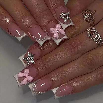 Picture of French Tip Press on Nails White Fake Nails Nude False Nails with Bow Charms Nail Gems Star Designs Glossy Pearl Rhinestones Glue on Nails Medium Length Nails Press on Acrylic Nails for Women 24Pcs
