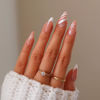 Picture of Christmas Press on Nails Medium Almond French Tip Winter Fake Nails Nude Full Cover White Snowflake False Nails with Designs Glossy Glue on Nails Xmas Acrylic Artificial Nails for Women Girls 24Pcs