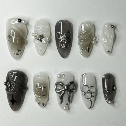 Picture of LBPEPAMZ Black Press on Nails Medium Almond Fake Nails with 3D Alloy Bow Pearl Designs Black Gradient Full Cover False Nails Water Drops Silver Star Glossy Acrylic Nails Stick on Nails for Women 24Pcs