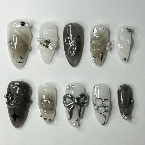 Picture of LBPEPAMZ Black Press on Nails Medium Almond Fake Nails with 3D Alloy Bow Pearl Designs Black Gradient Full Cover False Nails Water Drops Silver Star Glossy Acrylic Nails Stick on Nails for Women 24Pcs