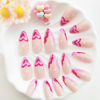Picture of Valentines Day Press on Nails Medium Almond Fake Nails with Red Love Heart Designs FrenchTip Nails Press ons Glossy Gule on Nails Pink Acrylic Nails Nude Stick on Nails for Women 24Pcs