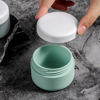 Picture of Kuangre Travel Containers for Toiletries, Silicone Cream Jars BPA Free, TSA Approved 2oz Travel Size Containers, Leak-proof Travel Essentials with Lid for Cosmetic Face Hand Body Cream (4 Pack)