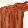 Picture of Socomi Fall Thanksgiving Table Runner Cheesecloth Table Runner Terracotta 120 inch 10FT Boho Rustic Gauze Table Runner for Wedding Party Baby Shower Fall Decor 10pcs