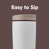 Picture of Owala SmoothSip Slider Insulated Stainless Steel Coffee Tumbler, Reusable Iced Coffee Cup, Hot Coffee Travel Mug, BPA Free 20 oz, Tan/White (Vanilla Bean)