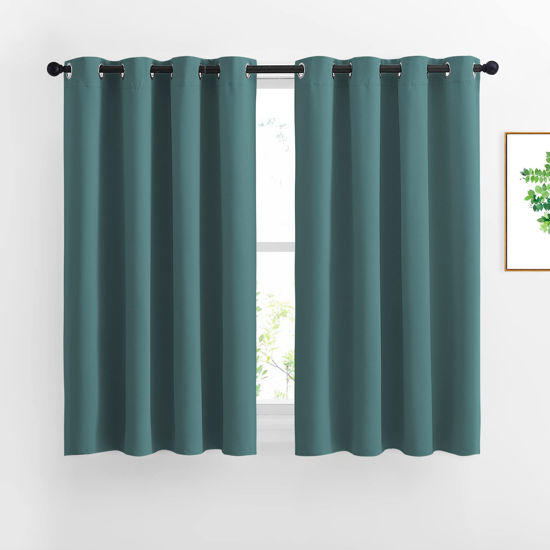 Picture of NICETOWN Blackout Curtains for Kids Room - Triple Weave Microfiber Home Thermal Insulated Solid Ring Top Blackout Panels/Drapes for Bedroom(Sea Teal, Set of 2, 52 x 54 Inch)