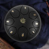 Picture of Eavnbaek Steel Tongue Drum - 8 Notes 6 Inch Steel Hand Drum with Bag, Music Book, Drumsticks, Mallet Holder and Finger Picks, Tongue Drum for Camping, Meditation or Yoga (Black)