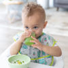 Picture of Bumkins Bibs for Girl or Boy, SuperBib Baby and Toddler 6-24 Months, Essential Must Have for Eating, Feeding, Baby Led Weaning Supplies, Mess Saving Catch Food, Waterproof Soft Fabric, Green Cactus