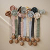 Picture of mushie Linen Baby Pacifier Clip Holder | Soft Fabric Strap, 2-Pack (Olive/Shifting Sand)