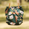 Picture of Esembly Cloth Diaper Outer, Waterproof Cloth Diaper Cover, Swim Diaper, Leak-Proof and Breathable Layer Over Prefolds, Flats or Fitteds, Reusable Diaper with Snap Closure, Size 2, Adventure Badges