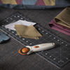 Picture of Fiskars 45mm Rotary Cutter for Fabric, Premium Steel Stick Fabric Cutter Cuts Through Multiple Layers, Right and Left Handed, Easy and Safe Blade Change, Arts and Crafts, Sewing and Quilting Tools